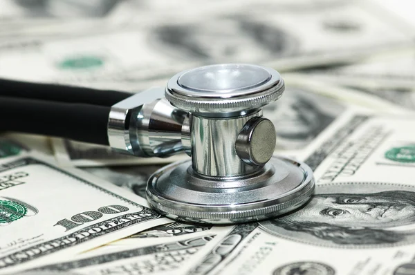 Stethoscope and dollars illustrating expensive healthcare
