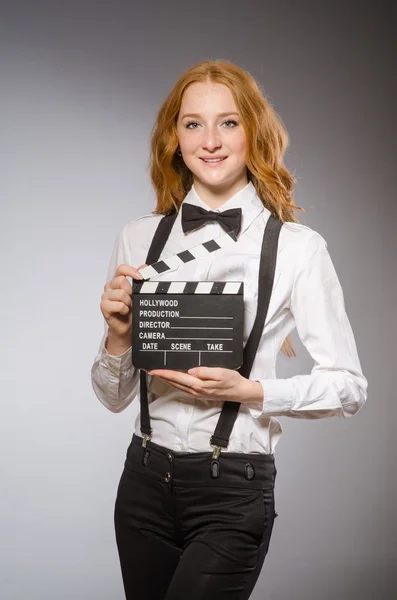 Woman with movie board