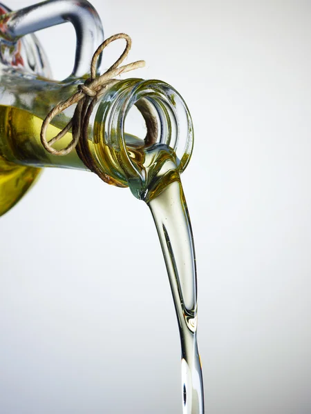 Olive Oil pouring from a bottle
