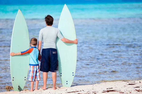 Father and son with surfboards