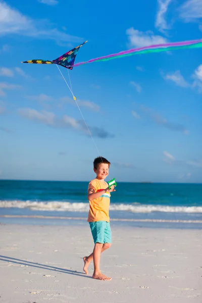 Little boy flying a kite