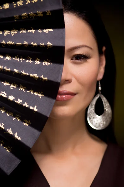 Portrait of asian woman with hand fan