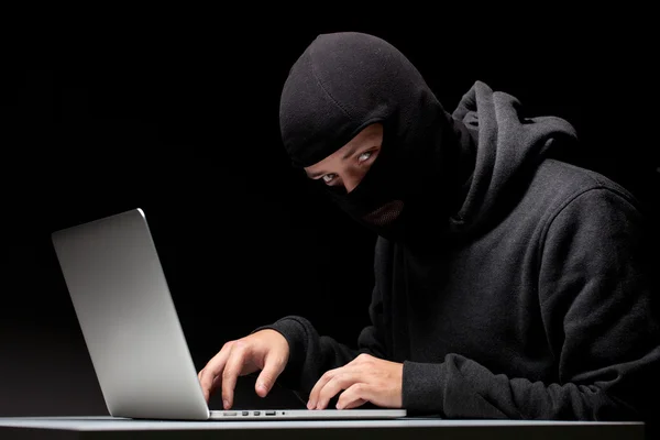 Computer hacker in a balaclava