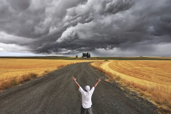 The enthusiastic tourist welcomes thunderstorm