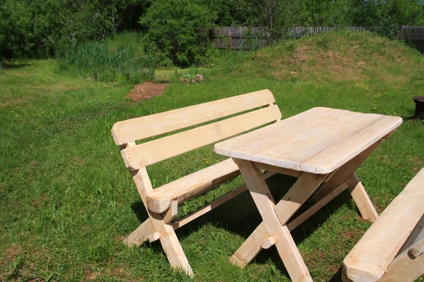 Wooden furniture in summer garden