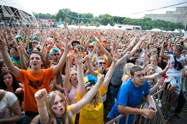 Football fans during footbal match at fan-zone