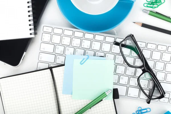 Office supplies, glasses and computed keyboard