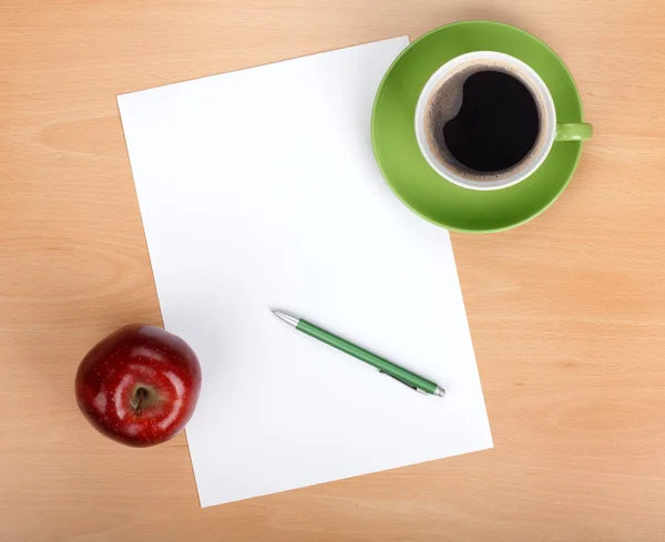Blank paper with pen, coffee cup and red apple