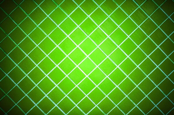 Colored tile wall background. Green