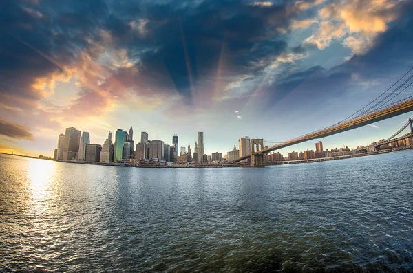 Spectacular view of Brooklyn Bridge from Brooklyn shore at winte