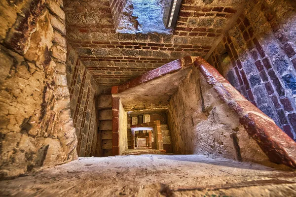 Ancient building interior with spiral staircase