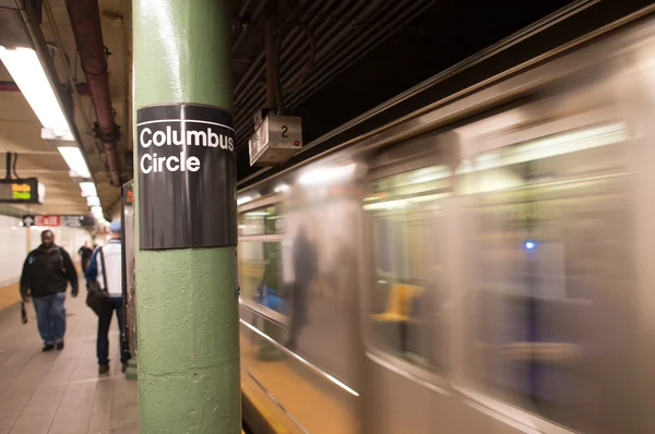 Train speeding up on a New York Subway station