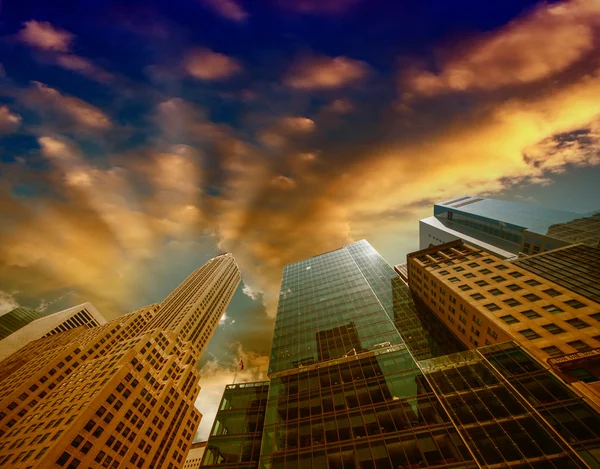 Looking up Lower Manhattan skyscrapers at sunset, New York City