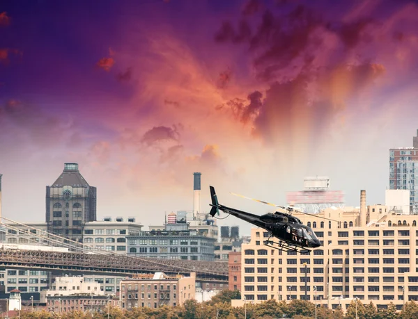 Black helicopter flying over New York City