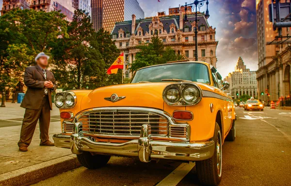 Vintage yellow taxi in New York City. Driver waiting for customers