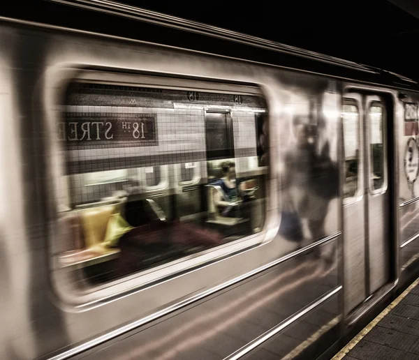 Subway train moving in Manhattan station, New York City