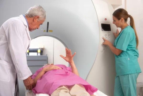 Senior woman undergoing CT test scan