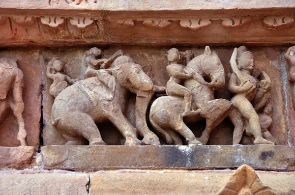 Carving of ancient warriors, elephents and horses on the battle