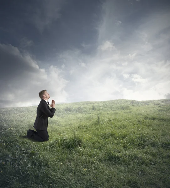 Businessman praying