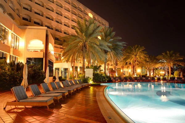 The swimming pool at luxury hotel in night illumination, Ajman,