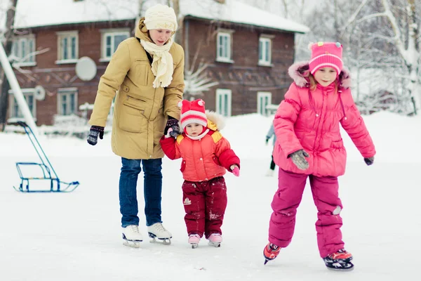 Mom and her daughters skating