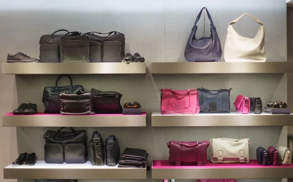 Bags on shelfes in boutique