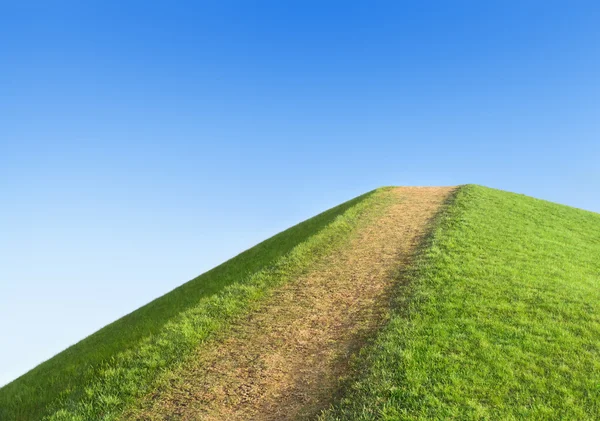 Pathway up the hill against the sky. Symbol development or caree