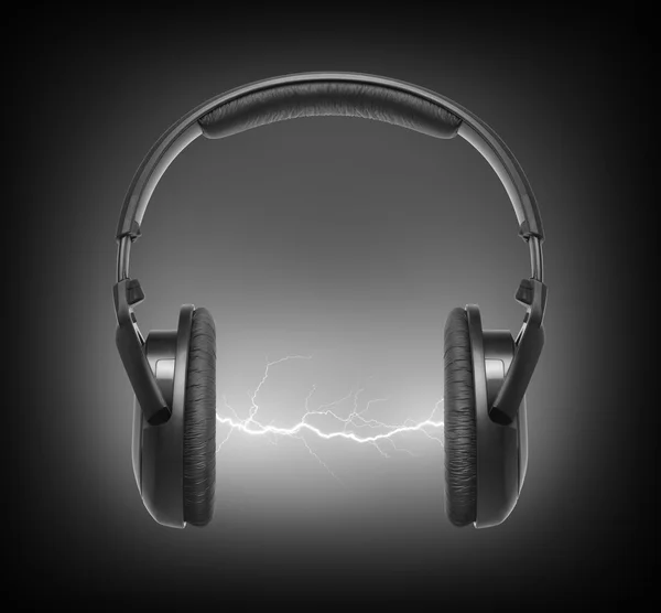 Headphones and lightning on black background