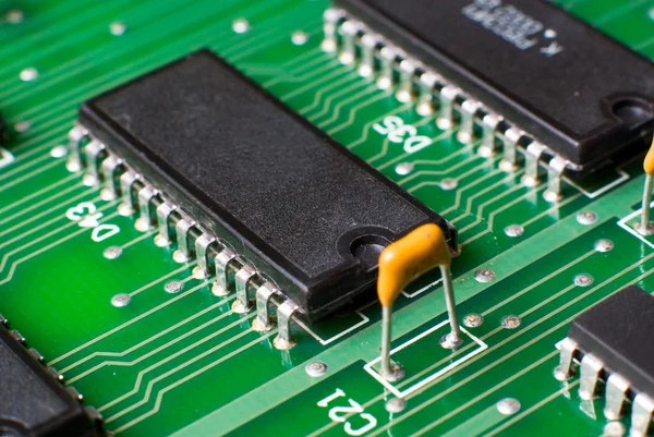 Macro silicon chip on green board — Stock Photo #15310059