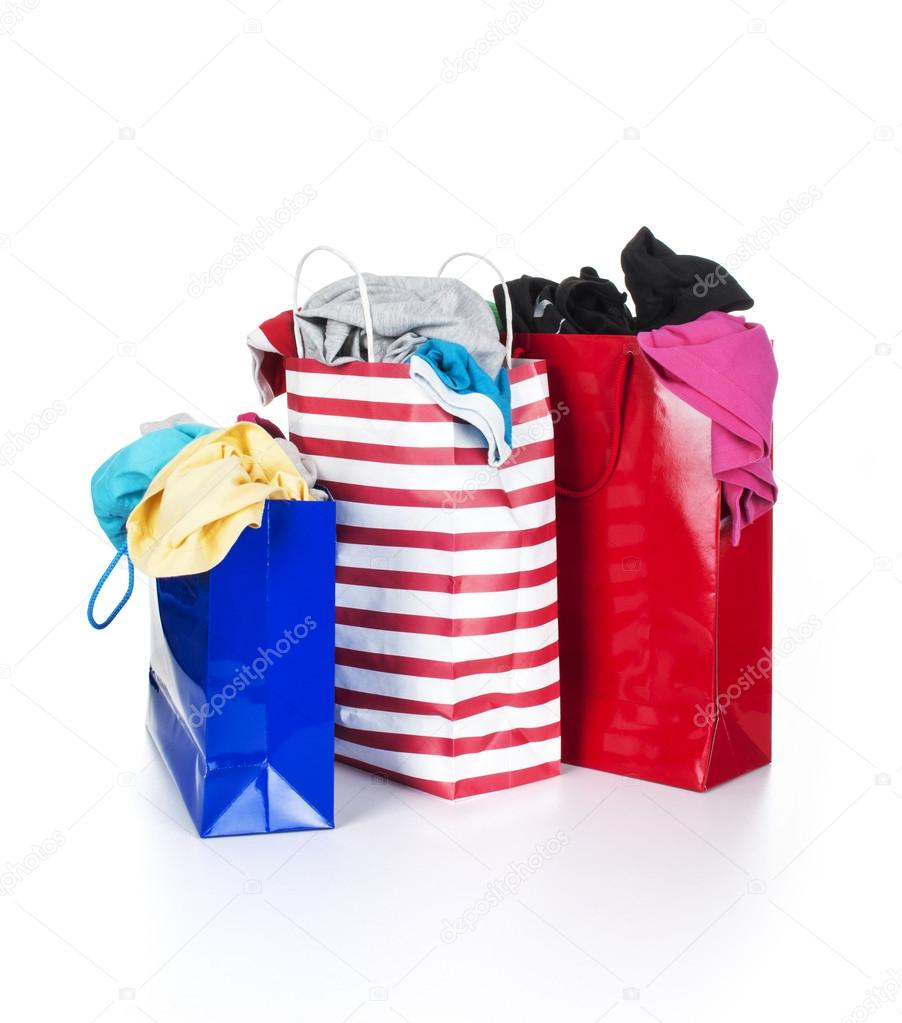 Paper shopping bags full of clothes — Stock Photo © urfingus 37819603
