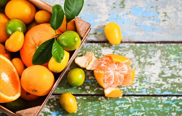 Fresh citrus fruits in the wooden box