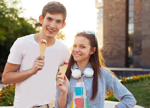 Cute young beautiful teen couple with ice cream