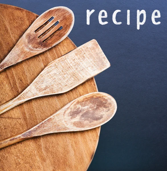 Kitchen utensils and an inscription in chalk recipe