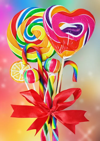 Colored sweets with red ribbon bow