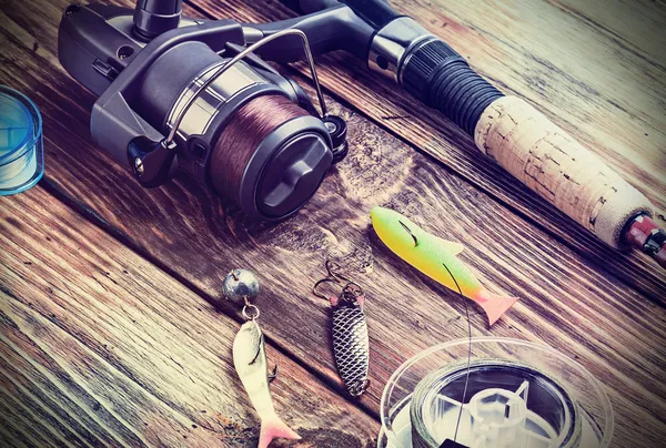 Fishing tackle on a wooden table