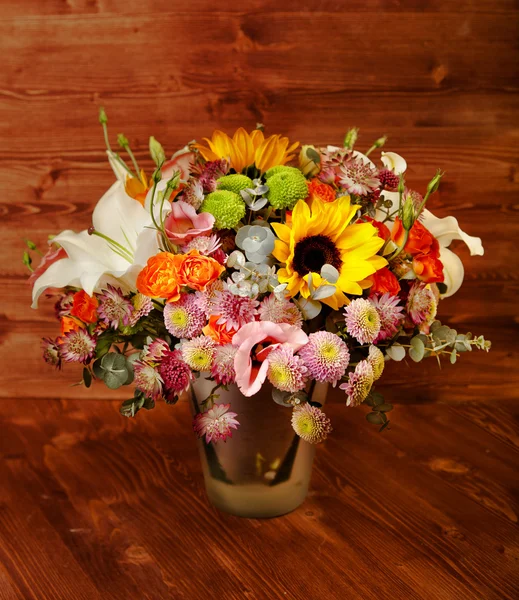 Floral bouquet with lily, sunflower, chrysanthemum, eustoma (lis