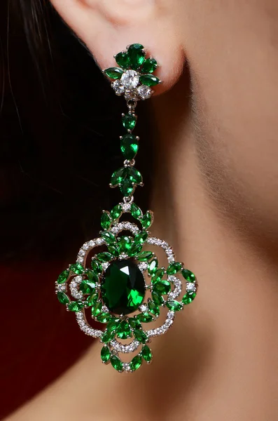 Female ear in jewelry earrings