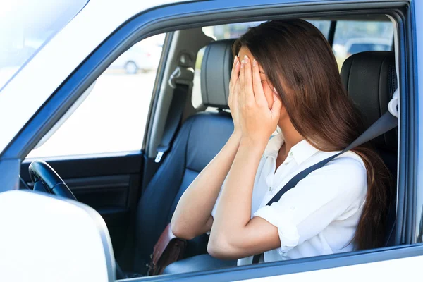 Crying woman in a car