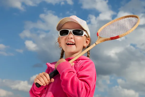 Little girl with racket for badminton
