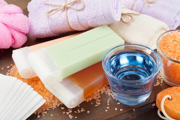 Body care accessories: towels, sea salt, soap, pumice stone and