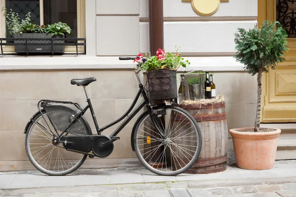 Old bicycle carrying flowers