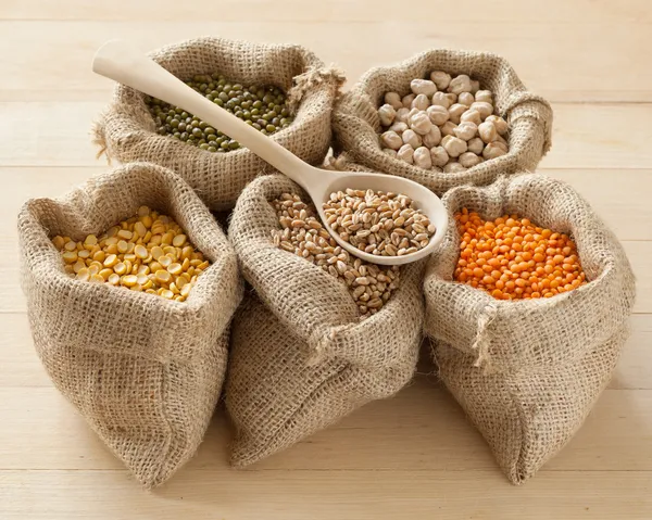 Hessian bags with peas, chick peas, red lentils, wheat and green