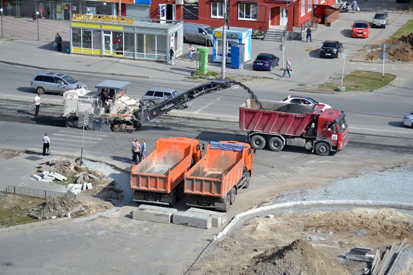 Roadwork. Removal of old asphalt by means of special equipment.