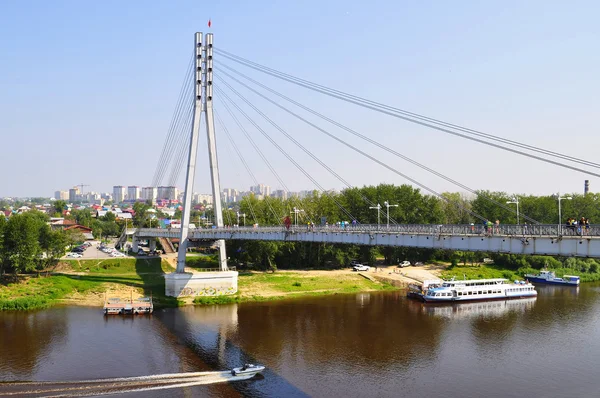 The foot cable-stayed bridge in Tyumen, Russia. Bridge of lovers