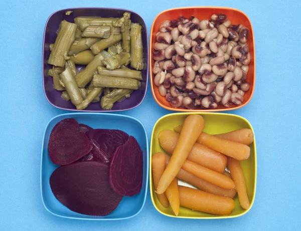 Carrots, Beets, Asparagus and Black Eyed Peas in Colorful Bowls.