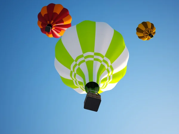 Colorful hot air balloons floating in the clear sky