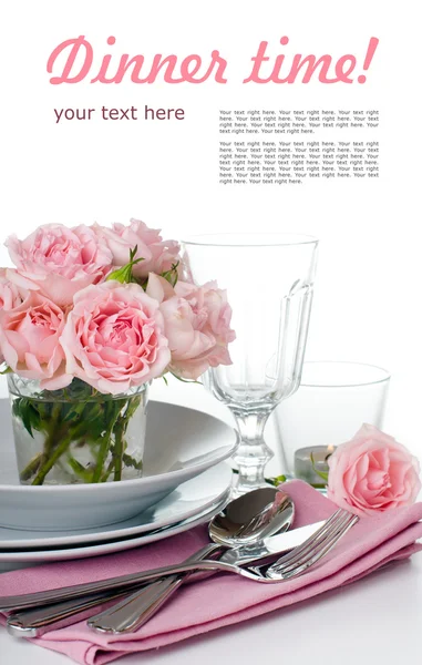 Festive table setting with pink roses