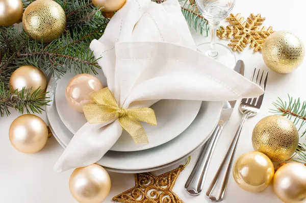 Christmas table setting in gold tones