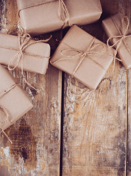 Gift boxes, postal parcels on wooden board