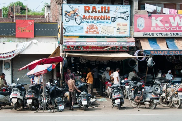 Chaotic motorbike repair service work, India